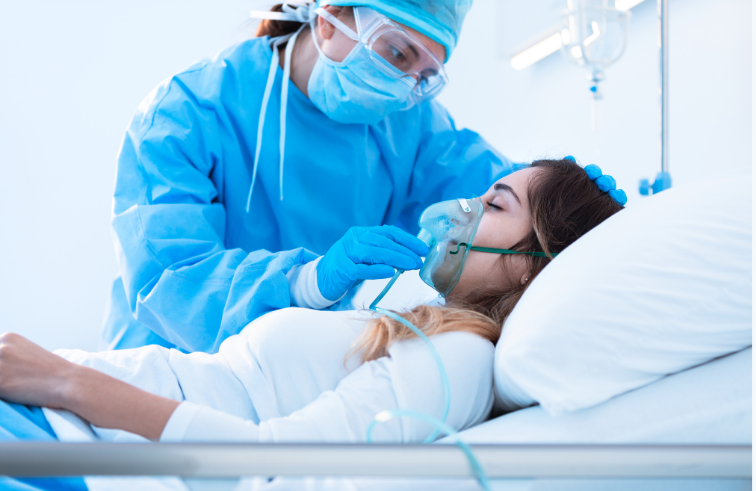 Nurse putting oxygen mask on patient.