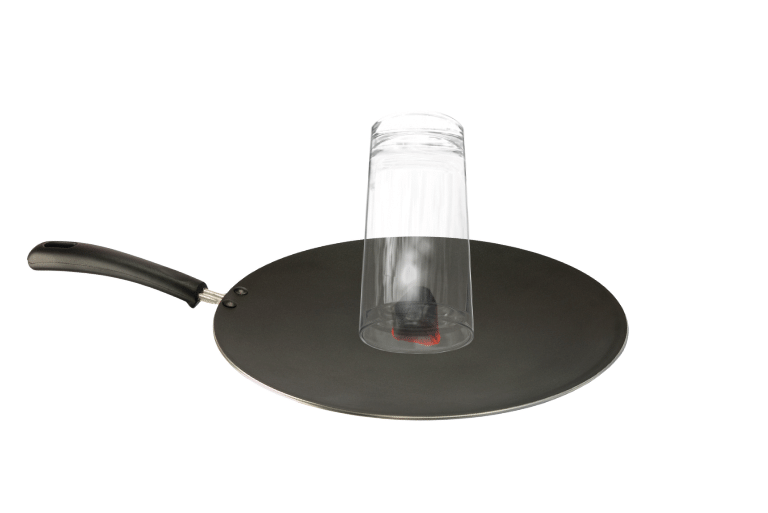 Burning charcoal on an iron plate.