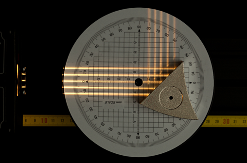 The mirror changes the direction of the incident rays.