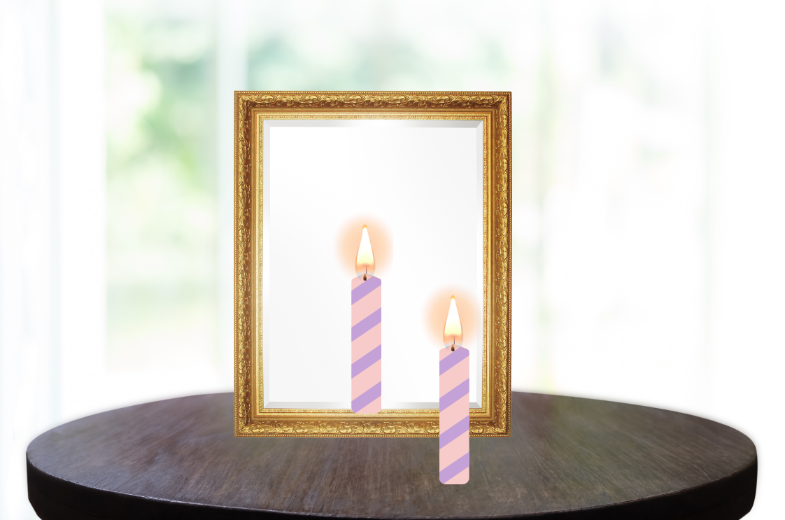 Candle placed in front of mirror.
