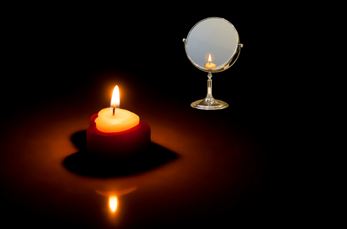 Candle placed in front of convex mirror.